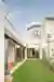 Empty Space Architecture Carves Courtyards Through a Lisbon House to Pull the Garden Inside