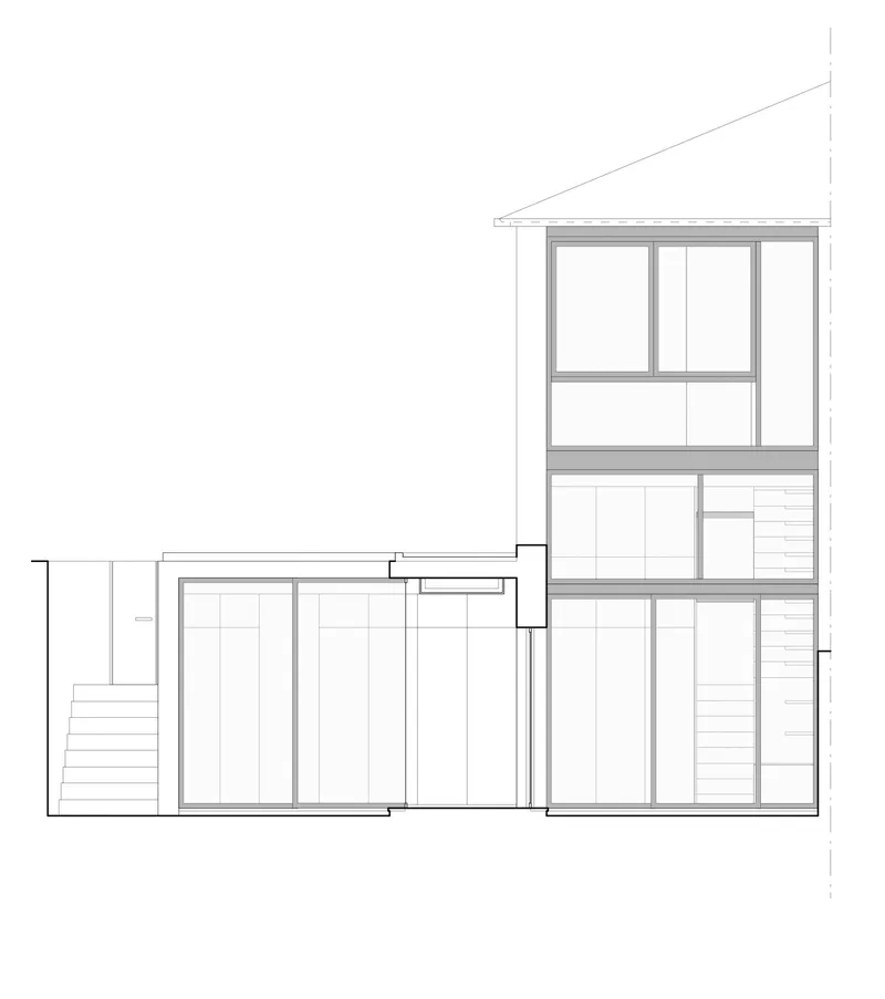 Section drawing through a multi-level residence showing staggered floor plates and window openings