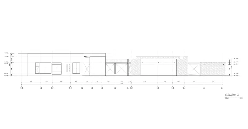 Elevation drawing showing a long horizontal facade with varied fenestration and textured wall sections