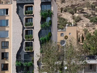 Ashari Architects Disguises a Shiraz Apartment Building as the Mountain Behind It