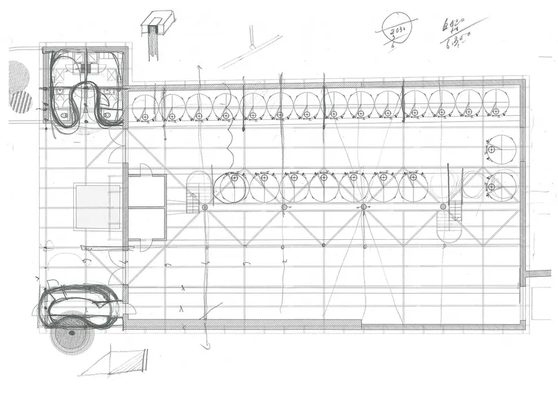 Floor plan drawing showing a rectangular hall with parallel rows of circular tanks and diagonal bracing