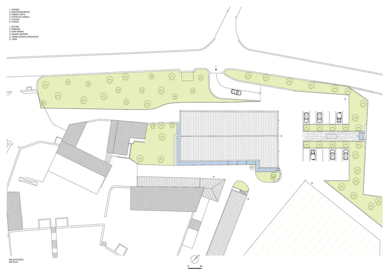 Site plan drawing showing a linear building with parking spaces and surrounding green areas with trees