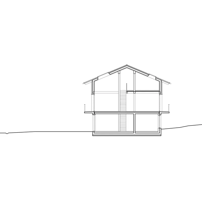 Section drawing revealing two-story interior with central staircase and pitched roof structure above sloping terrain