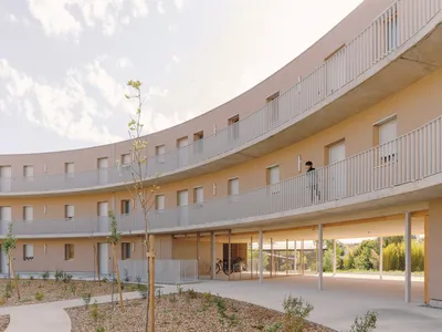 Régis Roudil Wraps 46 Timber-Framed Social Housing Units into a Curved Courtyard Near Toulouse