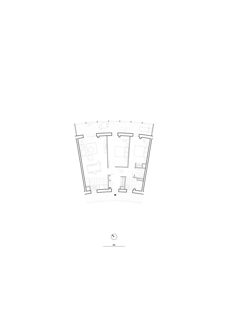 Floor plan drawing showing a residential unit with angled exterior walls and tiled bathroom zones