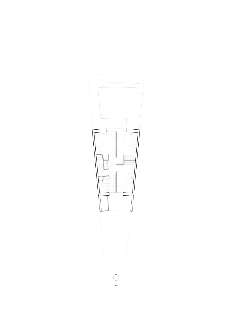 Floor plan drawing showing upper and lower levels of a narrow residential unit with central circulation