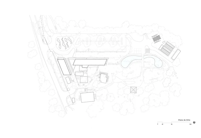 Site plan drawing showing building footprints, pathways, and surrounding landscape elements