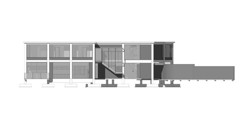 Section drawing cutting through the double-height spaces and diagonal staircase connecting the two levels