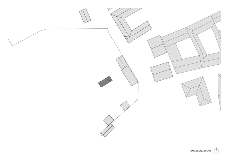Site plan drawing showing a single highlighted building among surrounding structures and pathways