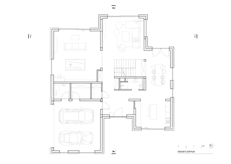 Ground floor plan drawing with garage, stairwell, and open living spaces arranged around a central core