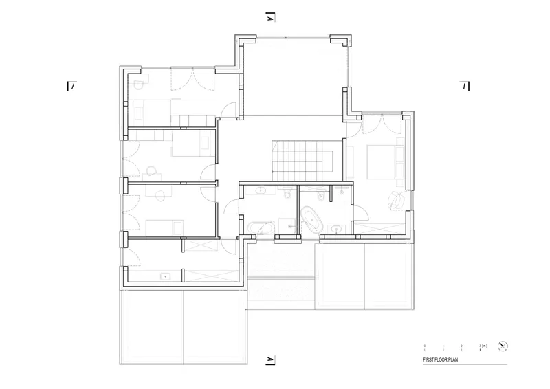 First floor plan drawing showing bedrooms and bathrooms clustered around a central stair and terrace
