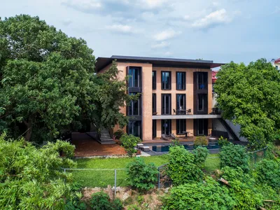 D and P Associates Build a Pi-Shaped House of Rammed Earth Memory on Vietnam's Red River