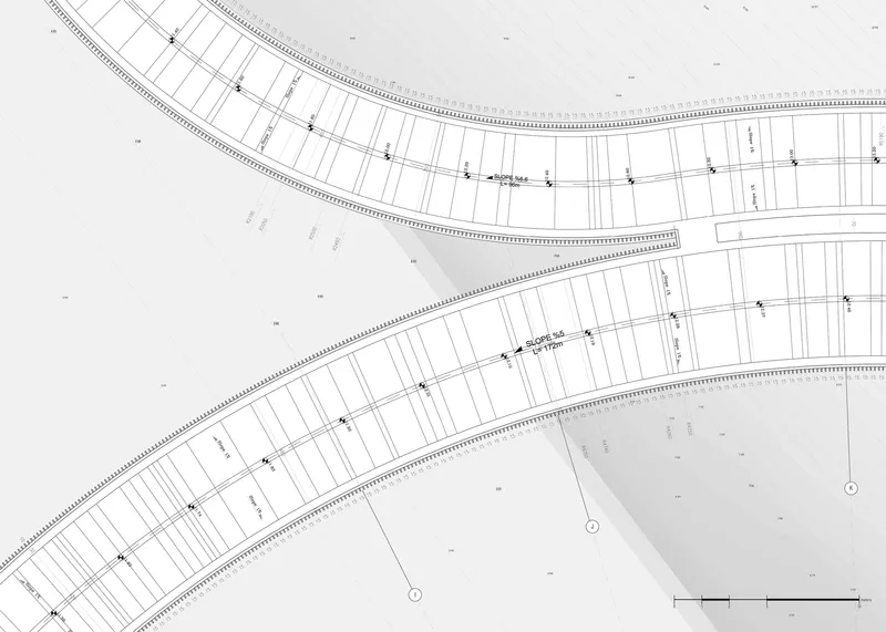 Site plan drawing showing curved pedestrian pathways crossing through parallel rows of rectangular building plots