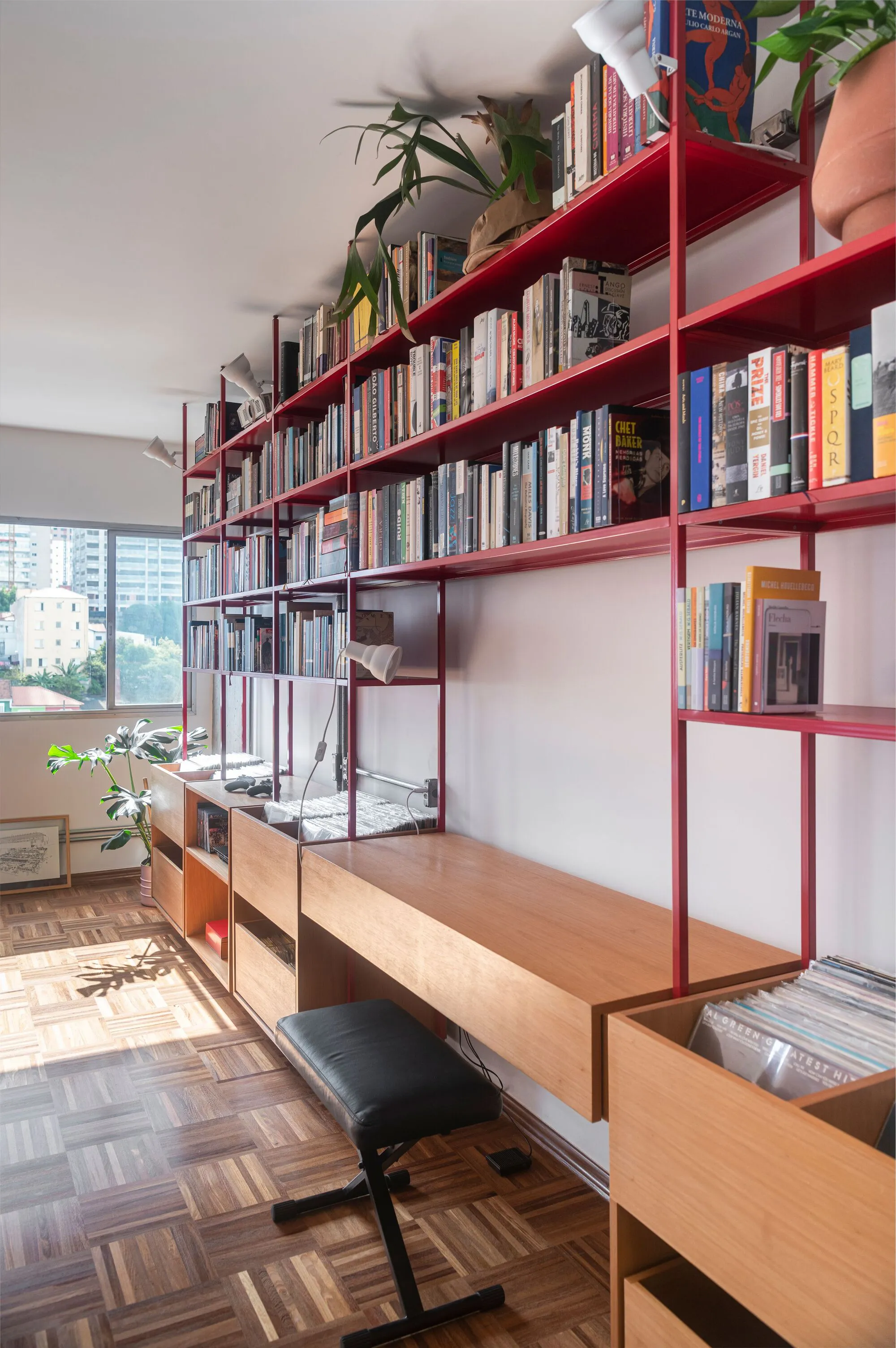 COTA760 Wraps a São Paulo Apartment in a Continuous Red Steel Bookshelf