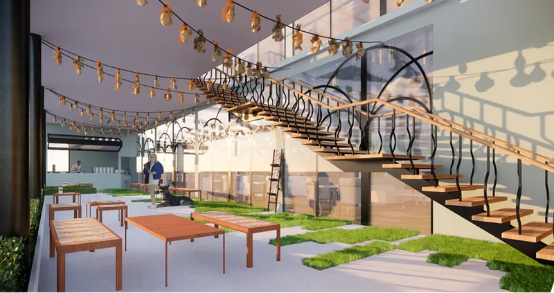 The informal courtyard seating area encourages casual interaction, blending landscape design with hospitality architecture.