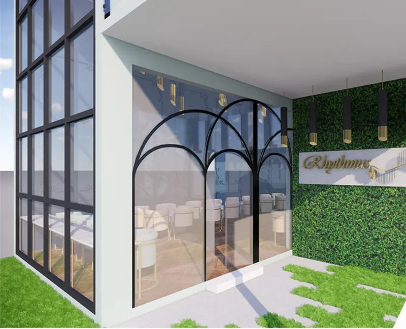 The cafe entrance combines transparent glazing, arched forms, and greenery to create a welcoming first impression.