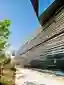 Kengo Kuma Wraps a Paris Museum in a Biological Skin of Aluminum and Wood