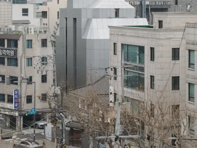 FHHH Friends Wraps a Seoul Music Academy in a Faceted White Shell That Echoes Its Interior Logic