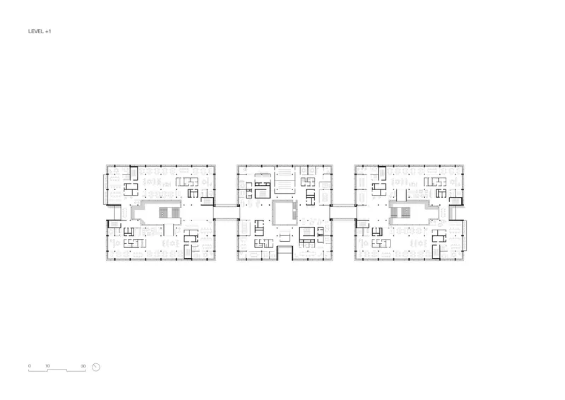 Floor plan drawing of three connected rectangular volumes with central cores and open floor areas