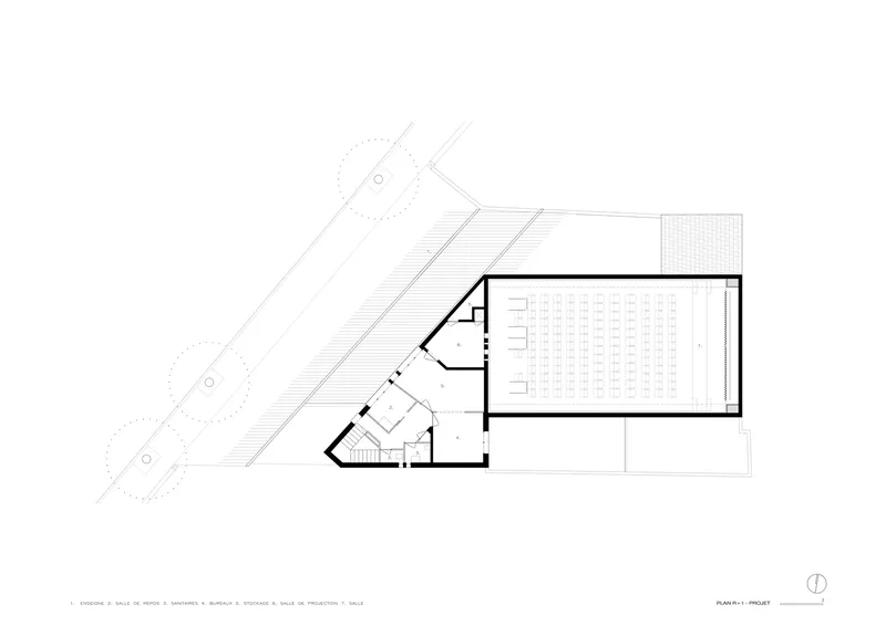 Level plan drawing showing the assembly hall with seating rows and a rooftop terrace above