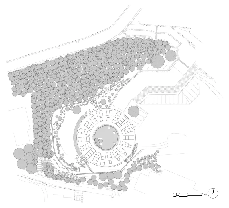 Site plan drawing showing circular structure surrounded by tree canopy and access paths