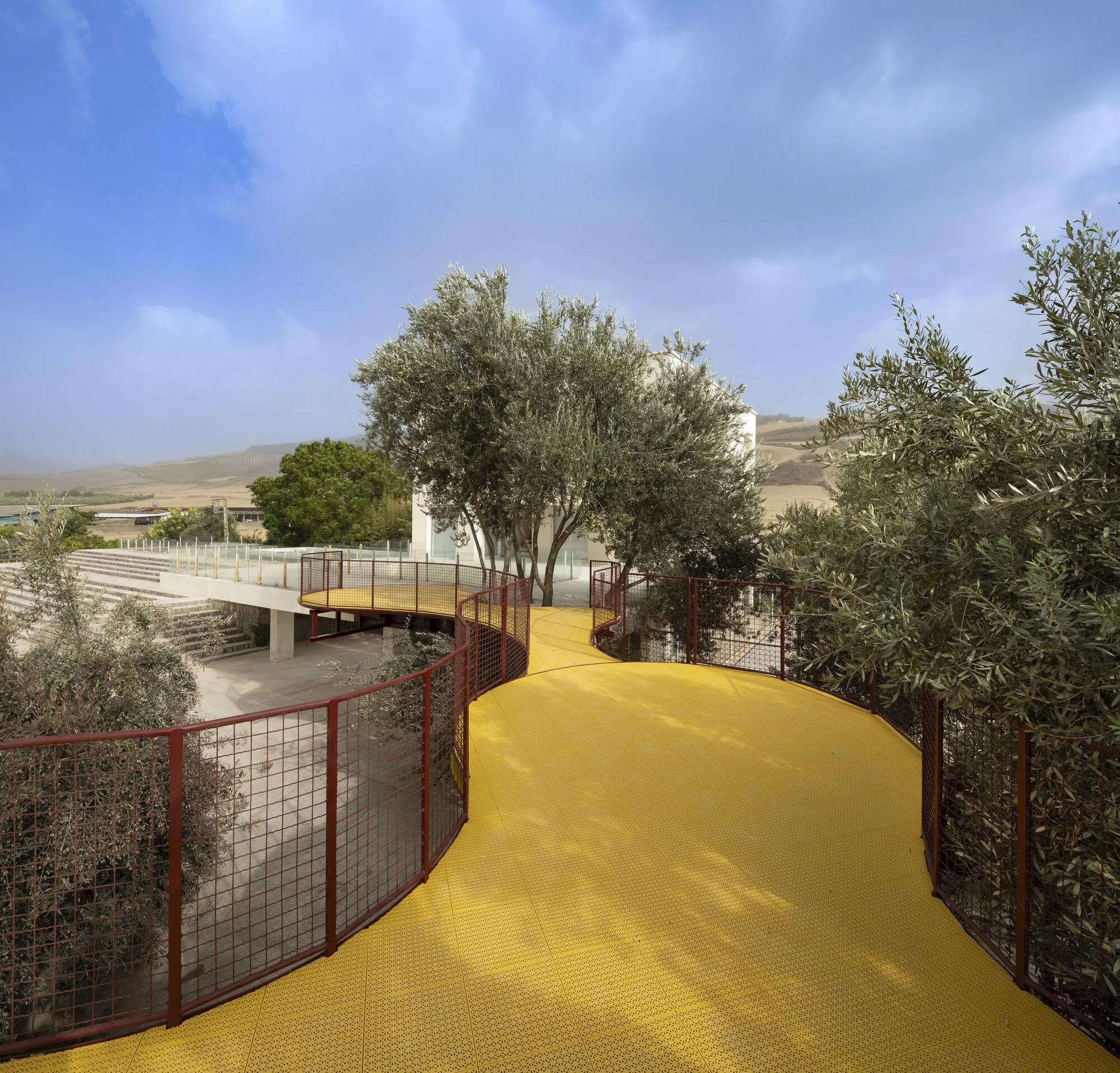 ZAV Architects Thread a Spiraling Playground Through a 40-Hectare Olive Orchard in Iran