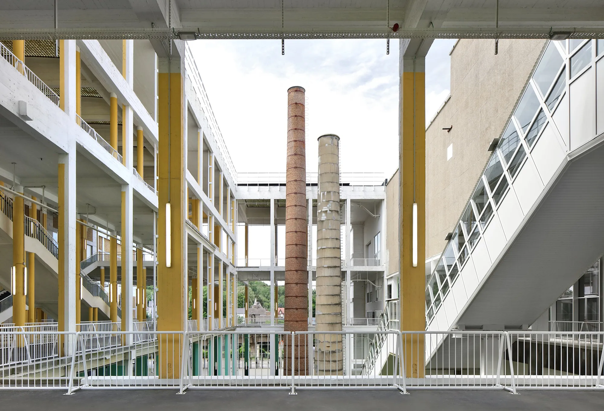 AgwA and architecten jan de vylder inge vinck Strip a 1950s Convention Center Back to Its Bones in Charleroi