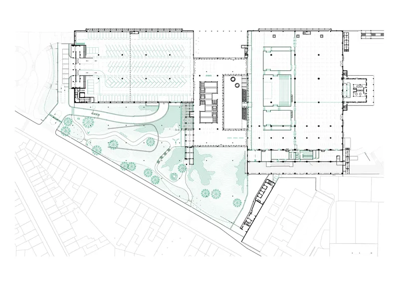 Site plan drawing showing the triangular complex with landscaped garden areas and adjacent street grid