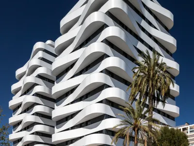 NAC Arquitectos Wraps Twin Valencia Towers in Spiraling Ribbon Balconies