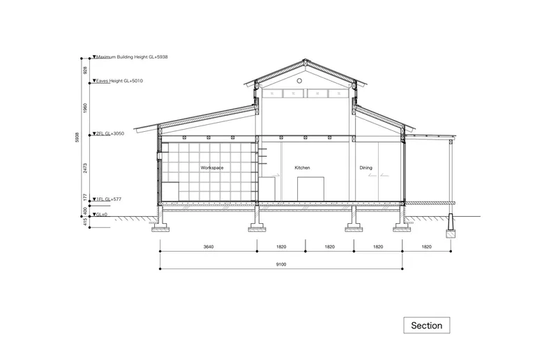 Section drawing showing the gabled roof, mezzanine workspace, and ground-level kitchen and dining areas