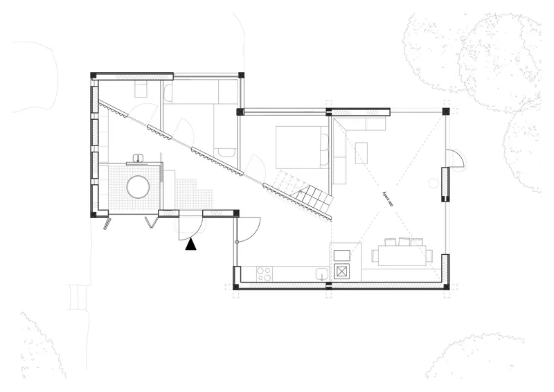 Floor plan drawing showing an open living area with diagonal stair and bathroom pod