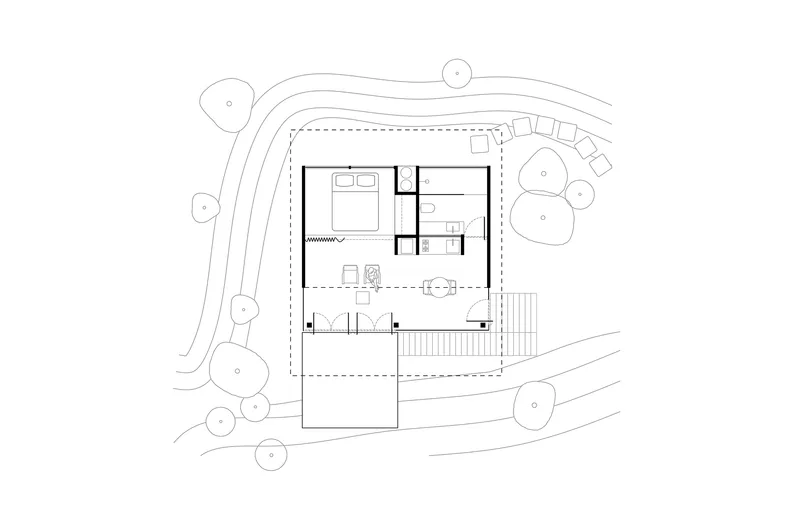 Site plan drawing showing a rectangular structure surrounded by curving pathways and circular tree canopies