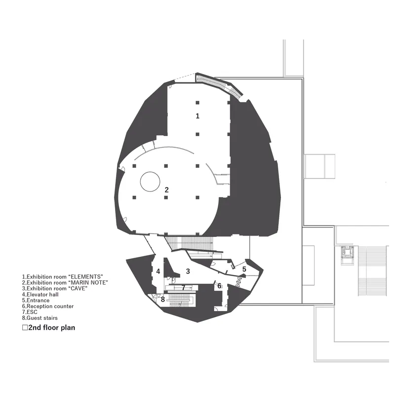 Second floor plan drawing showing rounded exhibition spaces and elevator hall in an organic form