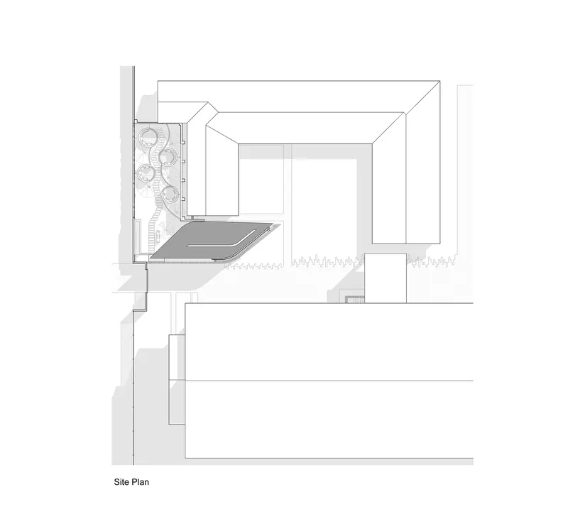 Site plan drawing showing building footprint with courtyard and adjacent structures