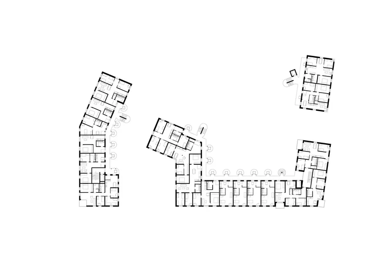 Floor plan drawing showing three residential wings with unit layouts and circulation cores