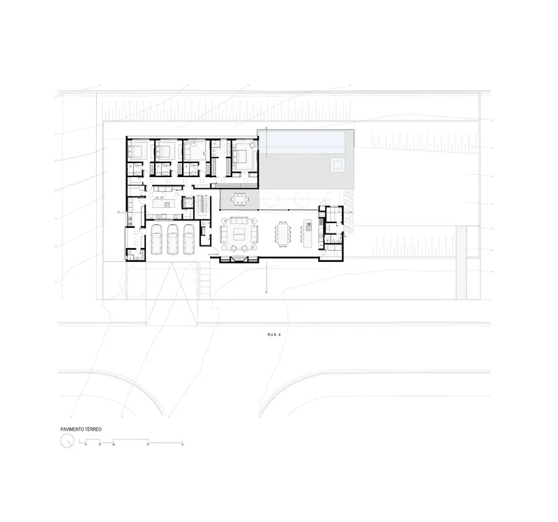 Ground floor plan drawing showing bedroom wing and open living areas flanking a central courtyard pool