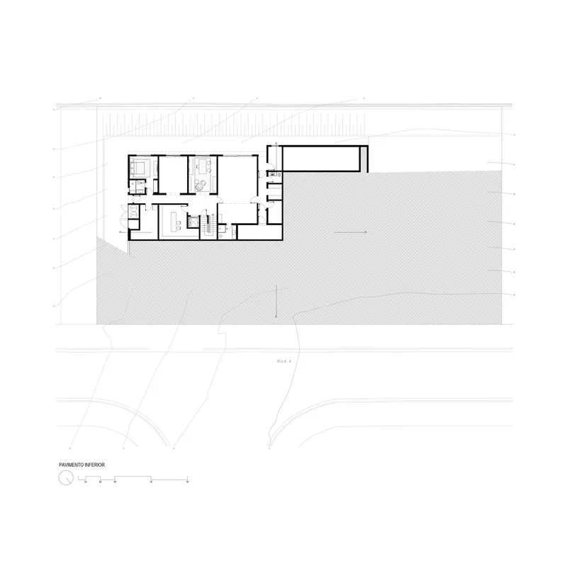 Upper floor plan drawing showing bedroom suites and large outdoor deck with hatched paving pattern