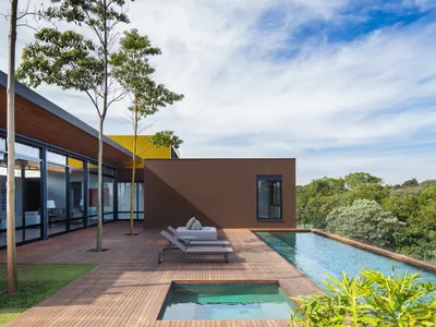 Ximenes Leite Arquitetura Grounds a São Paulo Residence in Earth Tones and Horizontal Restraint