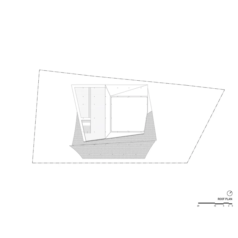 Roof plan drawing showing angular rooflines and hatched ground area within the trapezoidal site