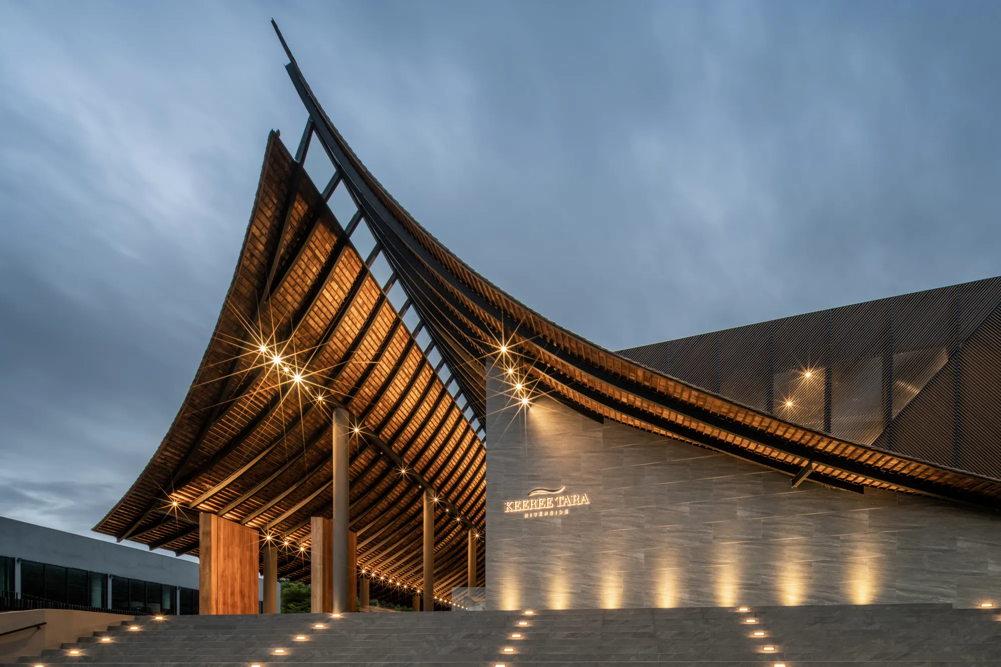 IDIN Architects Folds a Giant Gable Roof Down to the River at Keereetara Restaurant