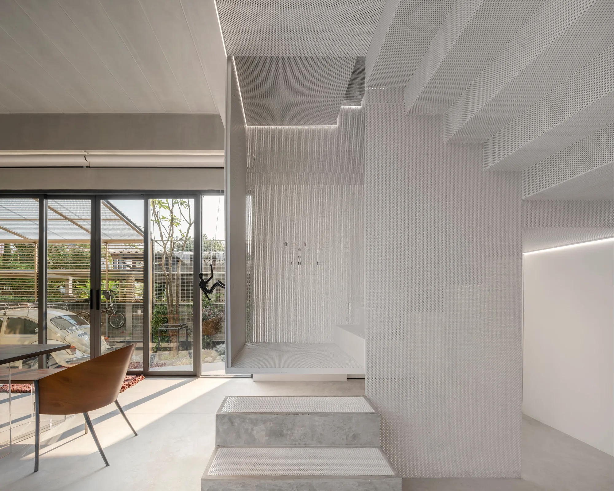 AUN Design Studio Folds an Origami Staircase Through a Multi-Generational Bangkok Home
