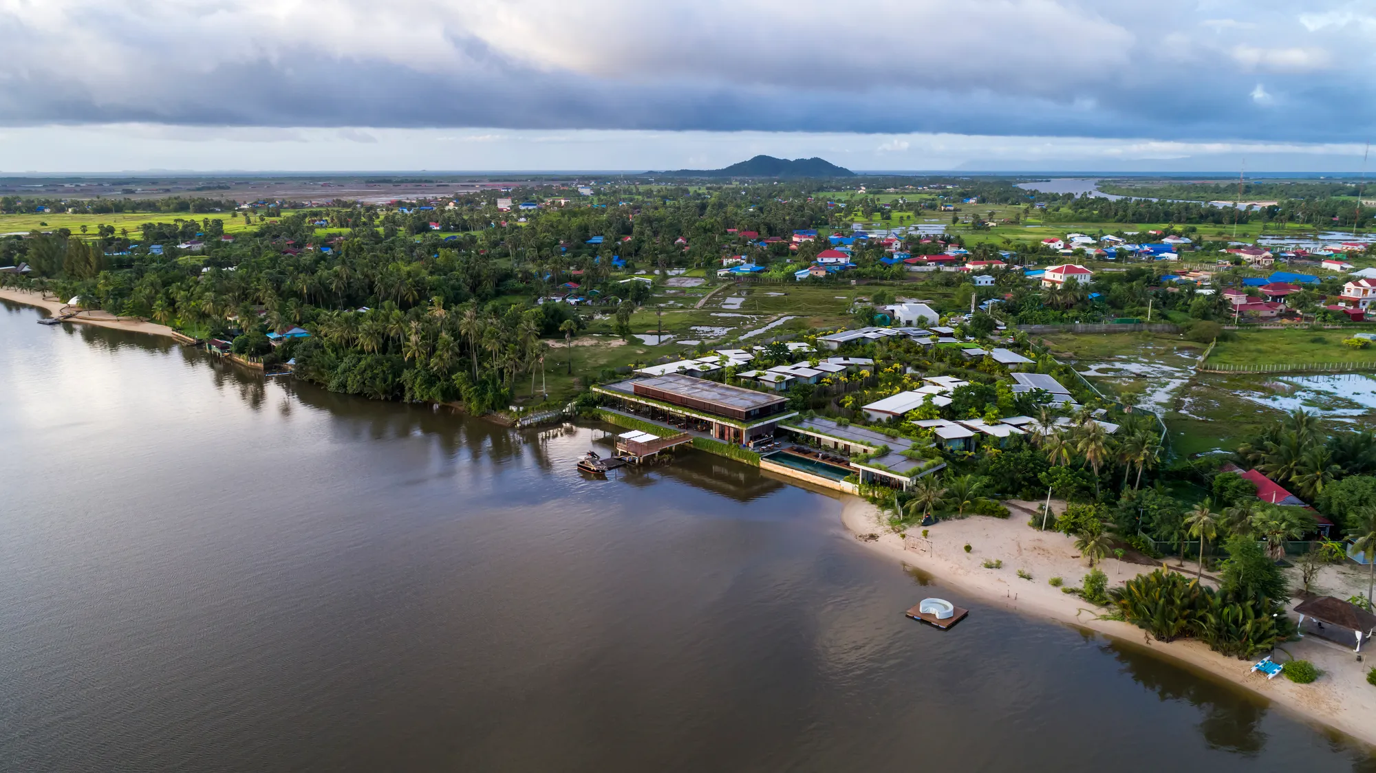 Bloom Architecture Scatters a Timber Resort Through Cambodian Mangrove Like a Fisherman's Village