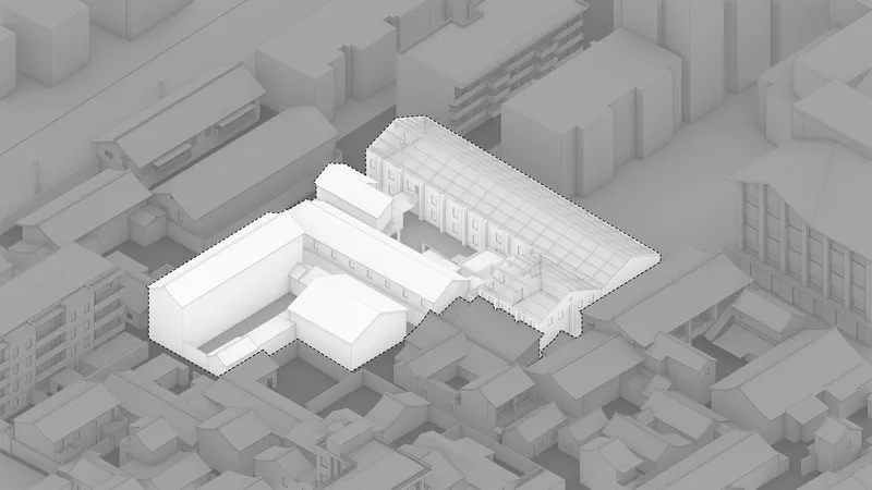Axonometric view of the L-shaped building complex with sawtooth roof within the urban block