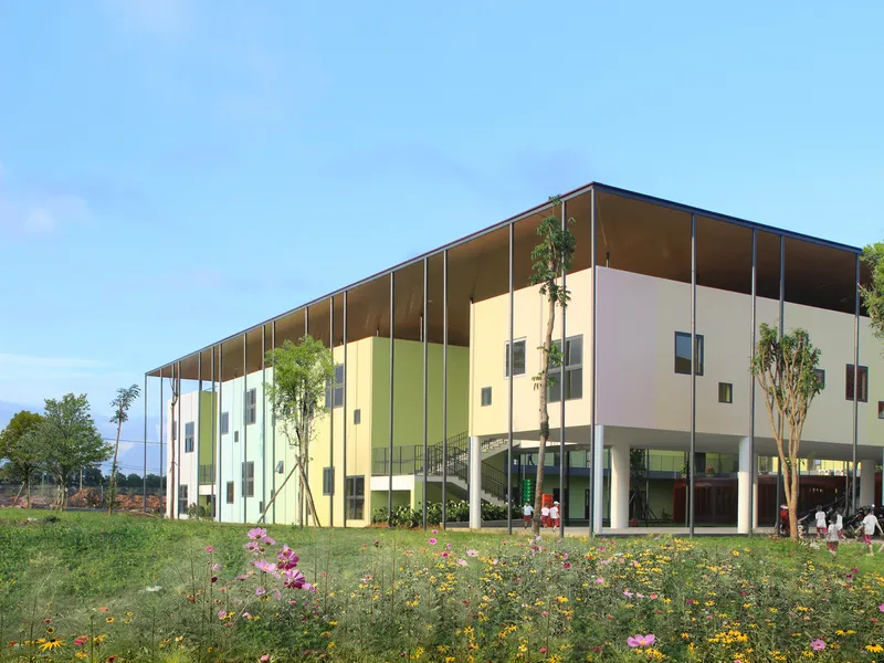 Side elevation showing thin canopy over colored panels with wildflowers in foreground