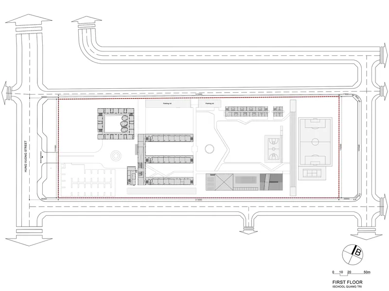 First floor plan with central courtyard, linear classroom wings and eastern sports hall