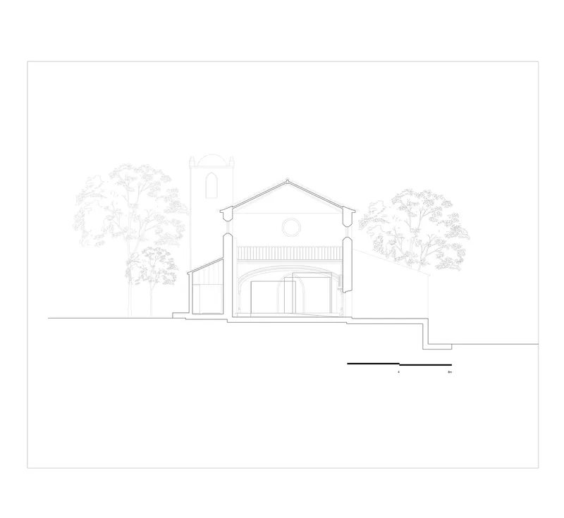 Elevation drawing showing a chapel-like facade with tower, gabled roof, and arched entrance flanked by trees