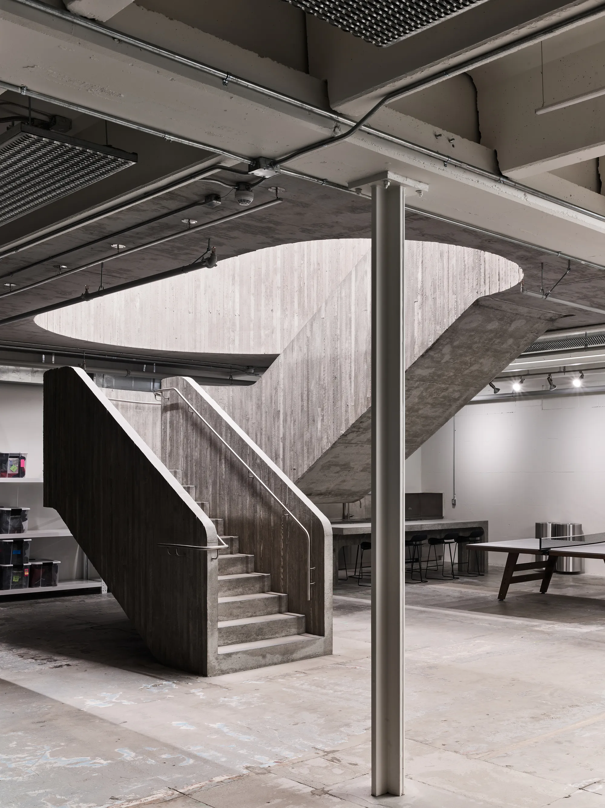 Scott & Scott Architects Carve a Concrete Staircase Through a 1973 Vancouver Warehouse for Purple Brand