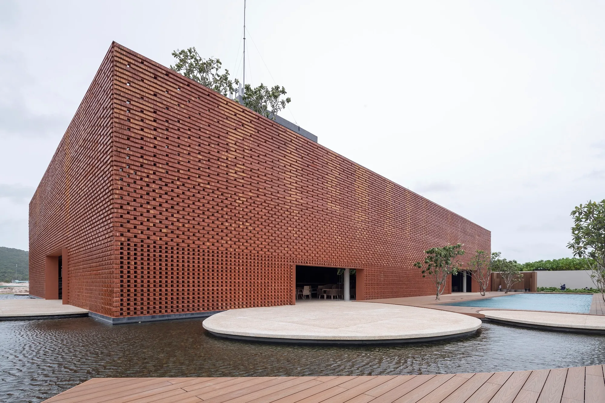 MIA Design Studio Wraps a Phu Quoc Clubhouse in Perforated Brick Inspired by Silk Lanterns