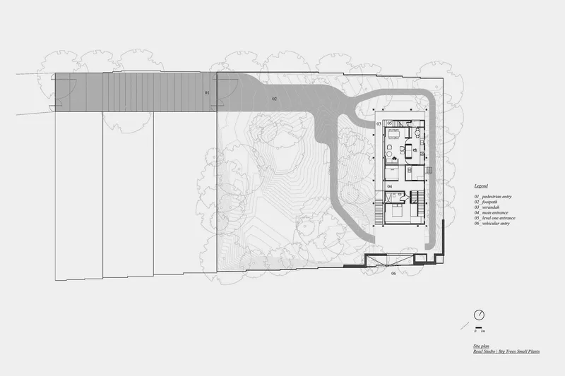Site plan drawing showing a rectangular building footprint with adjacent landscaped areas and topographic contours