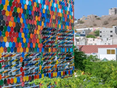 Ramos Castellano Arquitectos Wraps a Cape Verdean Art Center in 2,532 Recycled Drum Lids